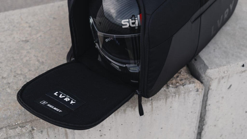 Stilo racing helmet stored inside LVRY CRRY driver bag—protective, organized compartment for racers.