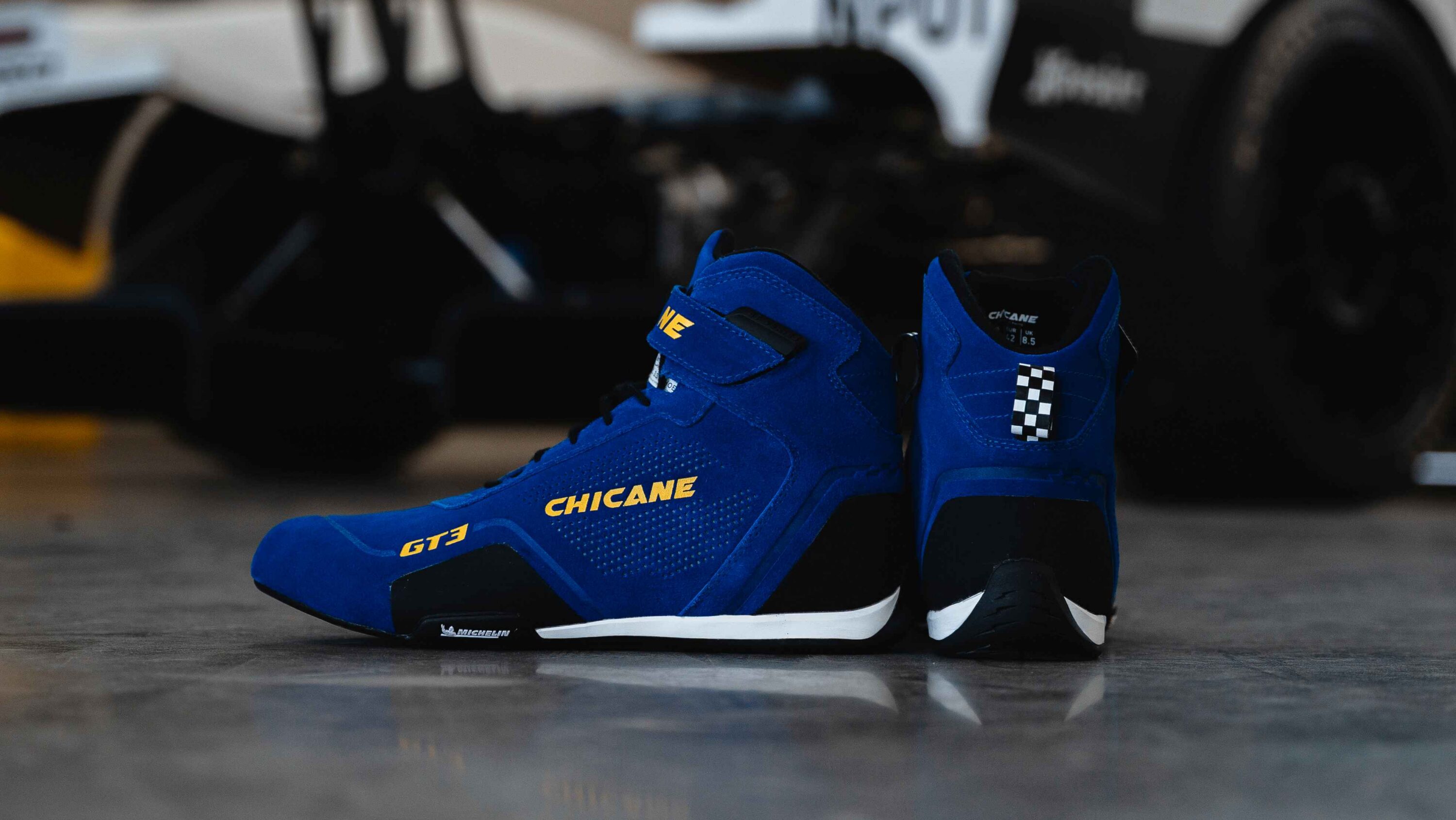 GT3 race-ready motorsport shoes in blue with Michelin performance soles and SFI-certified fire-resistant construction, offering accessible protection and pedal control for entry-level racing, drivers stepping into competition, and building a compliant race kit, available in men’s and women’s sizes.